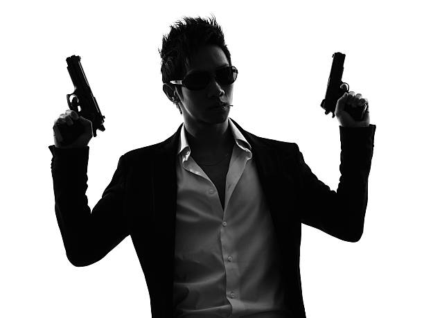 istock asian gunman killer portrait silhouette 482375789