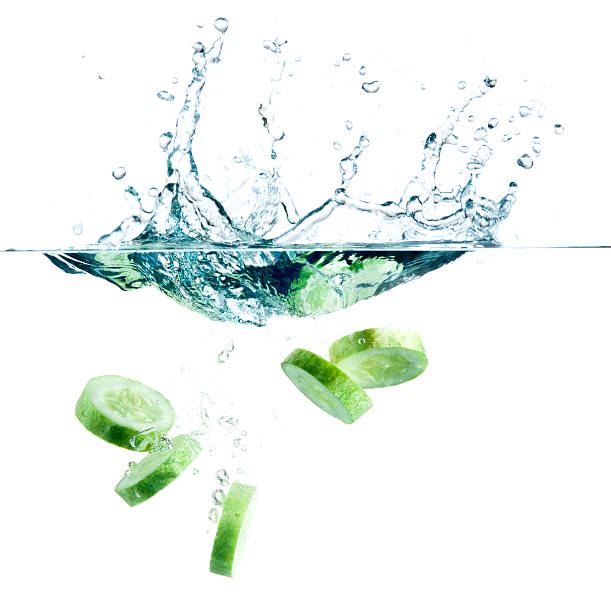istock sliced cucumber splashing water isolated on white background 482375847
