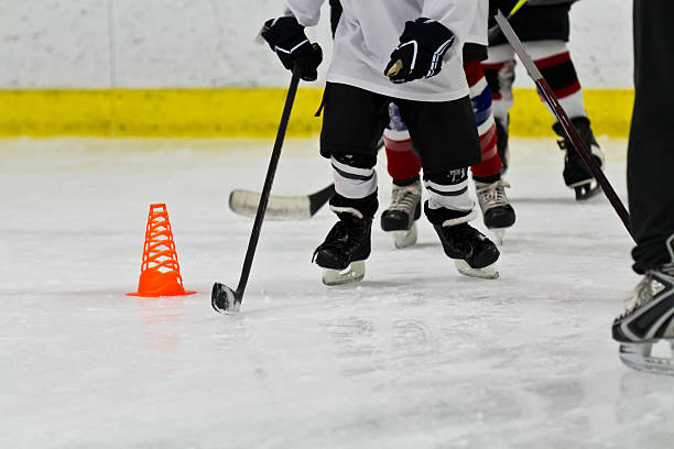 Youth ice hockey team at practice stock photo