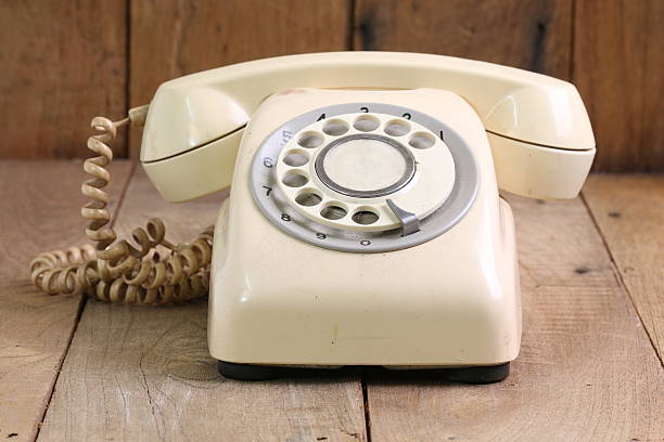 istock Retro rotary telephone on wood table 482376802