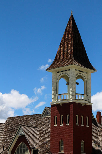 istock Dark red church bell tower with wooden shingles 482380674