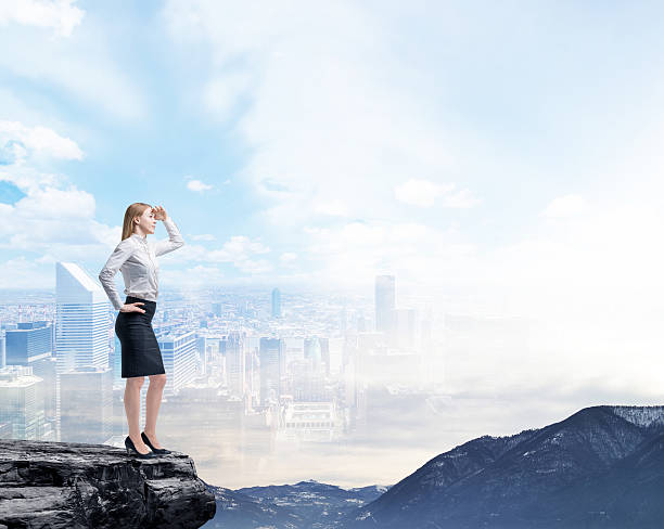 istock Business woman standing on a rock 482381028