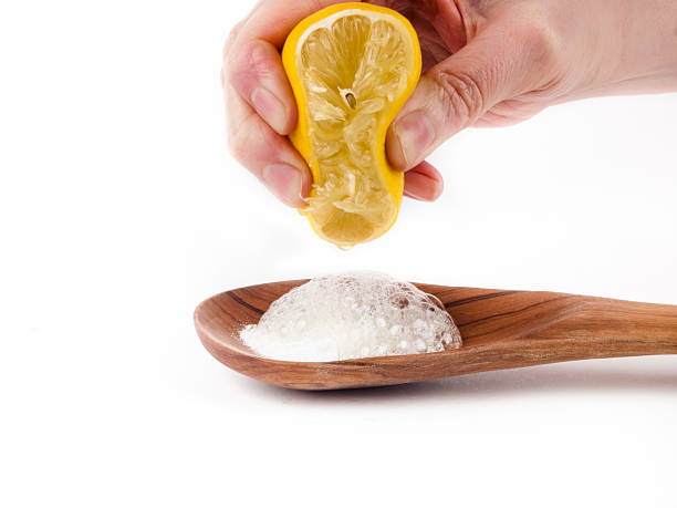 chemical reaction between baking soda and lemon juice stock photo