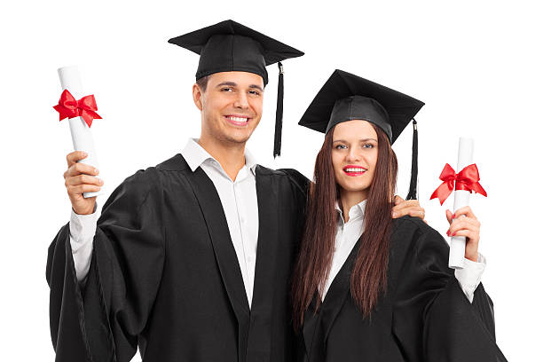 istock Young couple posing with their diplomas 482386618