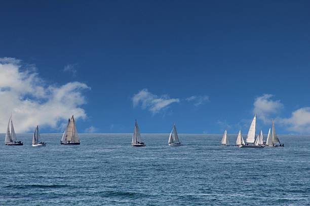 istock Sailing yachts in the wind on blue sky background 482389827