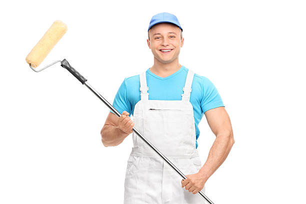 istock Young male house painter holding a paint roller 482390024