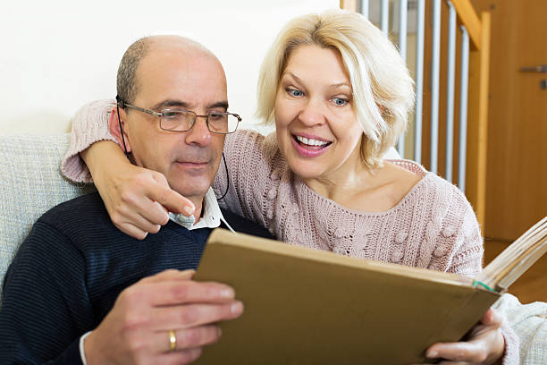 istock Happy pensioners watching old photoes 482390324