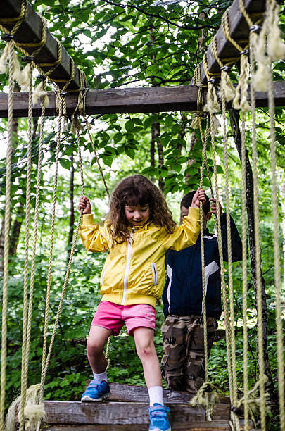 istock Boy and girl in course rope station 482391632