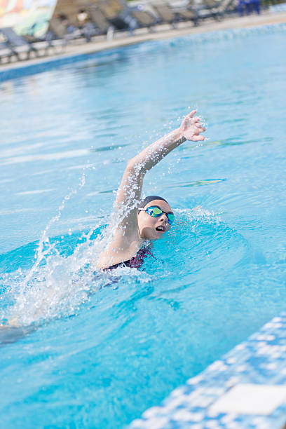 istock Woman in goggles swimming front crawl style 482392020