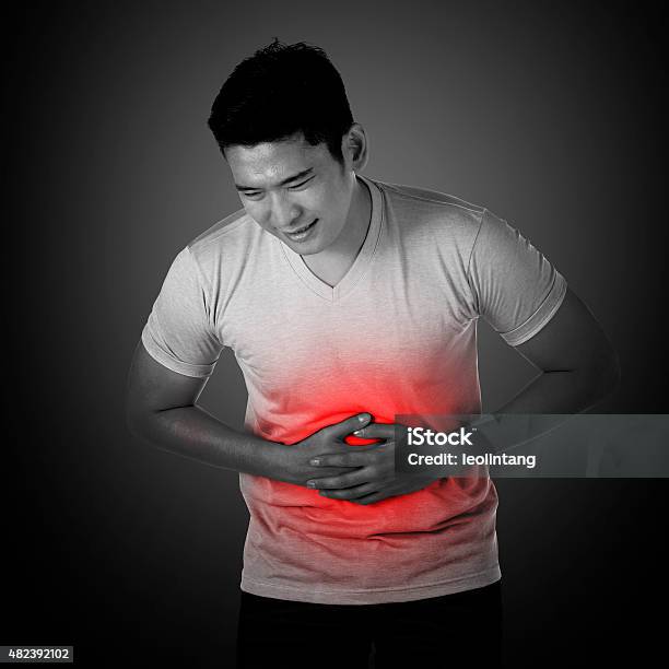 Asian Man Have Stomach Ache Stock Photo - Download Image Now - 2015, Abdomen, Adult