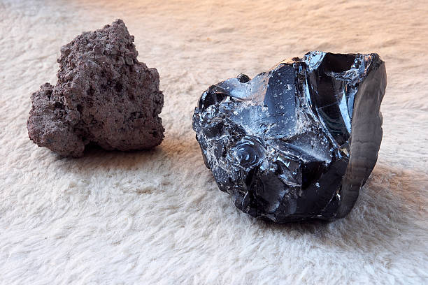 Lava stone and black obsidian stone. stock photo