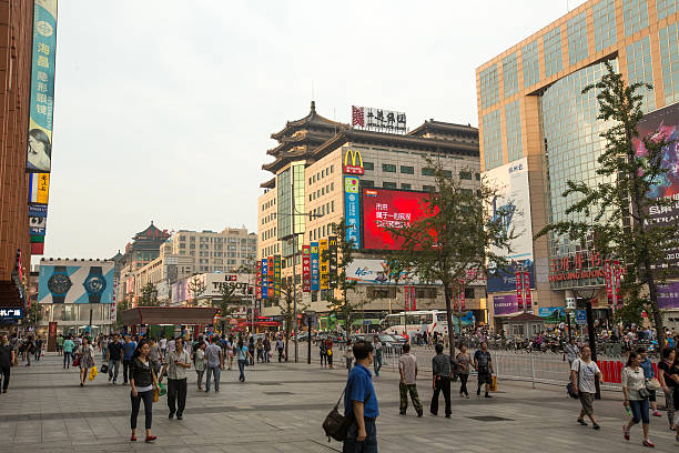 Crowds of people in the shopping street of Beijing Crowds of people in the shopping street of Beijing wangfujing stock pictures, royalty-free photos & images
