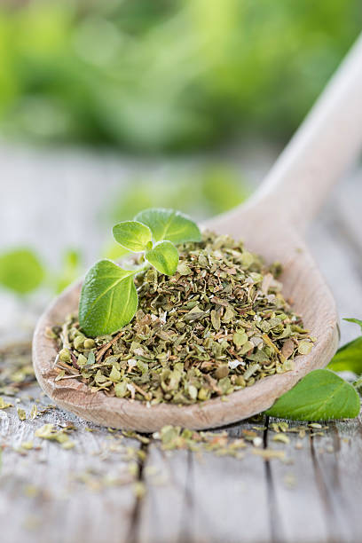 istock Oregano on a wooden spoon 482393859