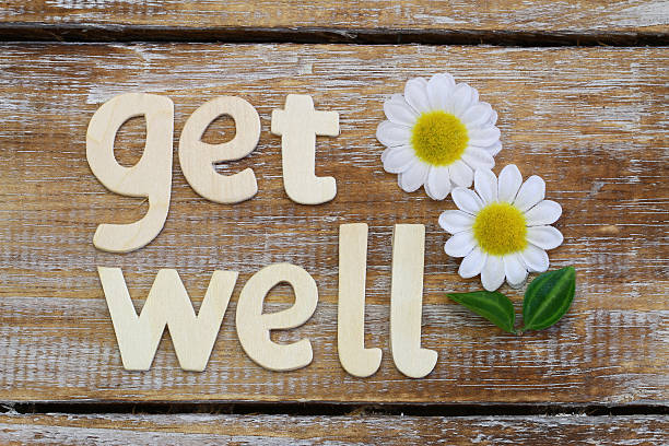 istock Get well written with wooden letters on rustic wooden surface 482399086