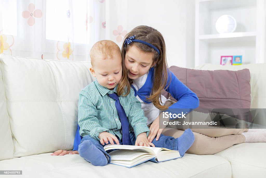 Children reading book 8-9 Years Stock Photo