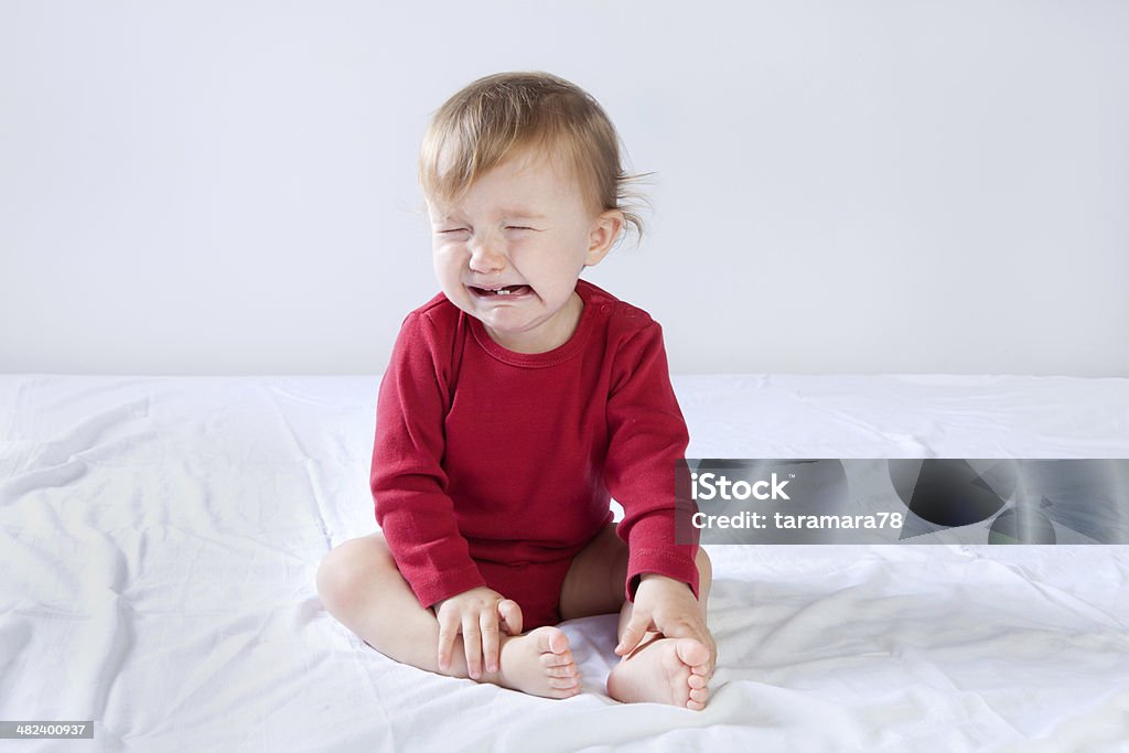 Cry baby Little baby girl crying 12-23 Months Stock Photo