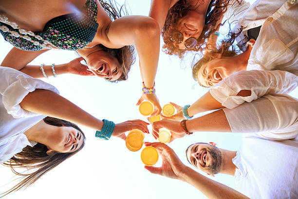 Group of Friends Cheers Group of Friends Cheers beach bar stock pictures, royalty-free photos & images