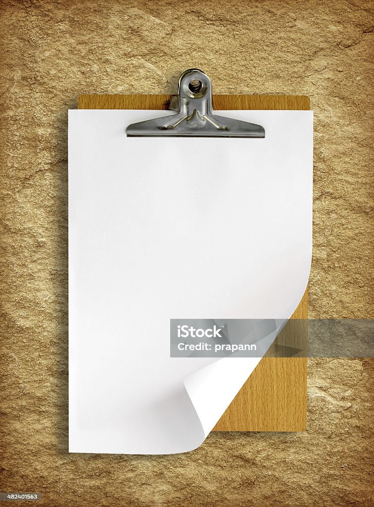 clipboard with white paper on stone background Block Shape Stock Photo