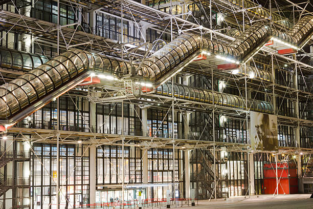 Centre Georges Pompidou Paris, France - 19th March 2014: The outside of the Centre Georges Pompidou in Paris at night showing the modern design of the building pompidou center stock pictures, royalty-free photos & images