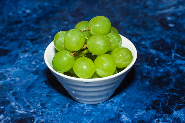 Green grapes in white bowl