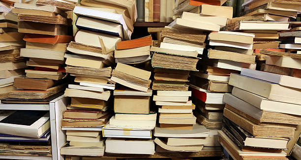 istock books piled up for sale in the great library 482406890