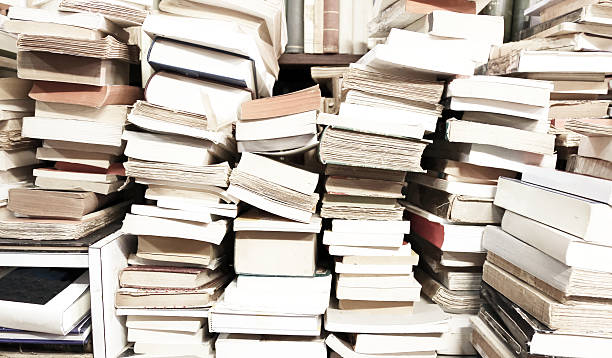 istock books piled up for sale in the great library 482407466