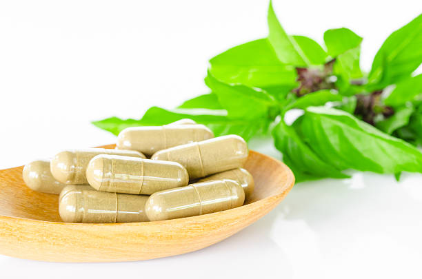 istock Yellow herbal capsule medicine drug. 482411810