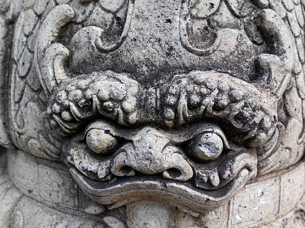 istock close up Chinese stone statue in Wat Pho, Bangkok, Thailand 482412007