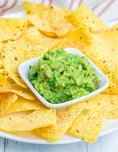 istock Cup with chunky guacamole served with nachos 482412212