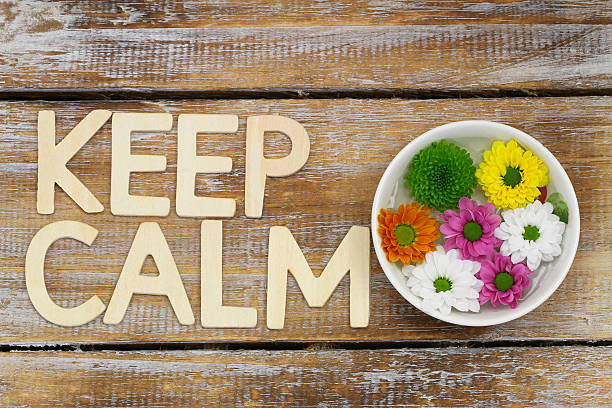 istock Keep calm written with wooden letters and Santini flowers 482412468
