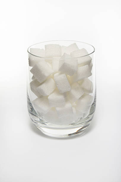 istock Sugar cube in glass isolated on white background. 482415369