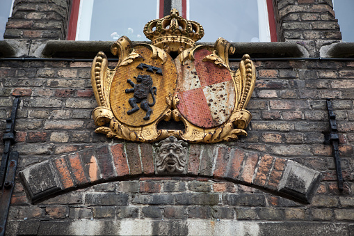 Decoration on old houses of Bruges in Belgium