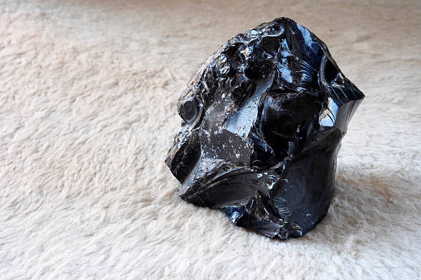 Black obsidian stone. Volcano lava. stock photo
