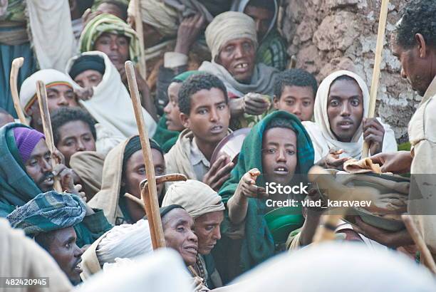 Volunteers Hand Out Food To Pilgrims After Christmas Lalibela Ethiopia Stock Photo - Download Image Now