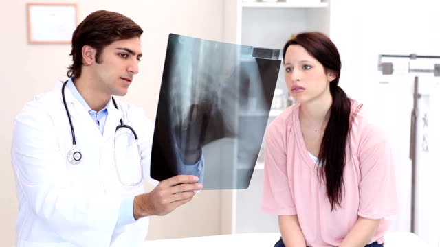 Doctor explaining a Xray to his patient