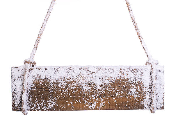 wooden board in the snow. on a white background