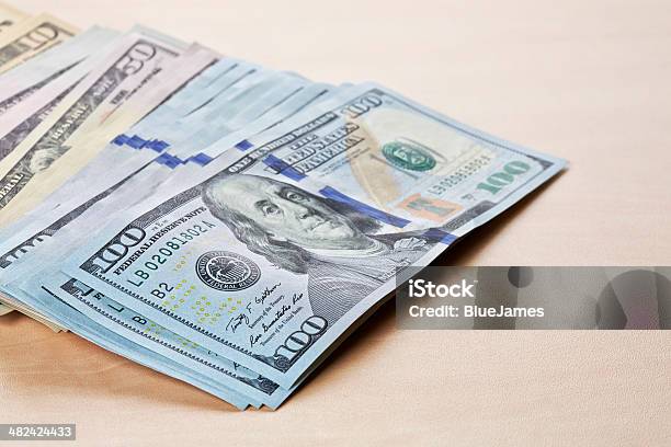Dollars Notes On Wooden Table Stock Photo - Download Image Now - American One Hundred Dollar Bill, Backgrounds, Banking