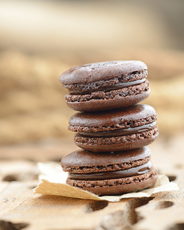 Three Macaroons with chocolate stacking together