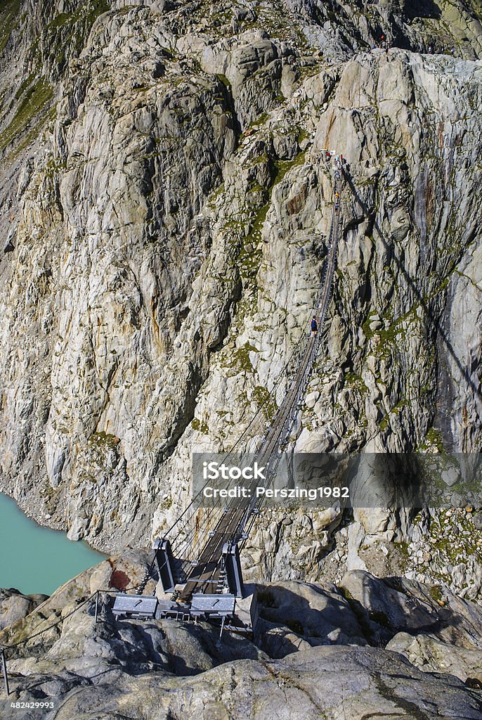 The bridge spans the lake, Triftsee, Switzerland Architecture Stock Photo