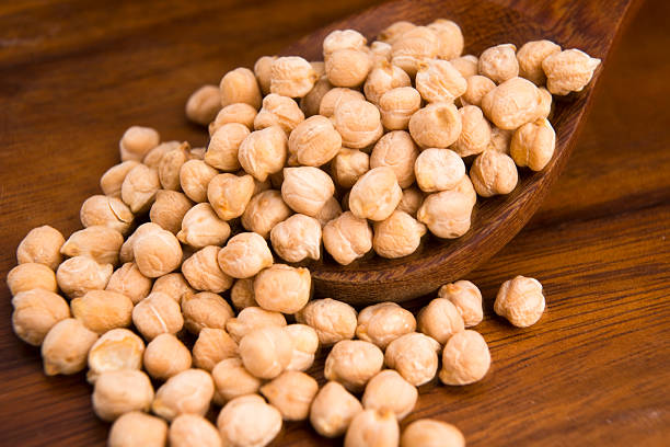 istock dried white chickpeas ceci on the wooden spoon 482430317