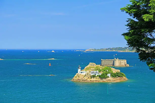 Lighthouse on the Ile Louet, right behind of it the Château du Taureau, Bay of Morlaix, Finistere, English Channel, Brittany, France