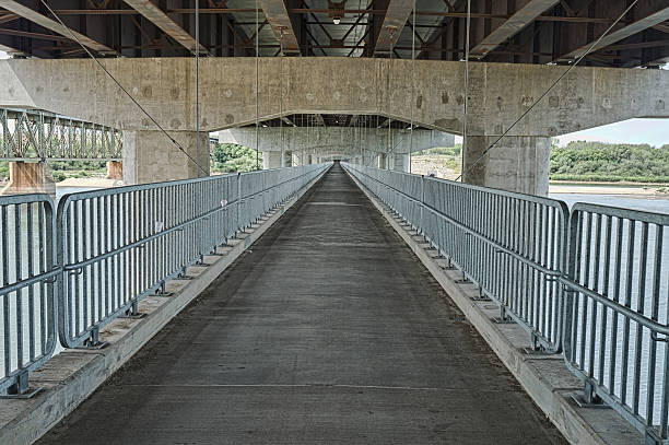 istock Suspended Pedestrian Walkway Beneath Traffic Bridge in Saskatoon 482434654