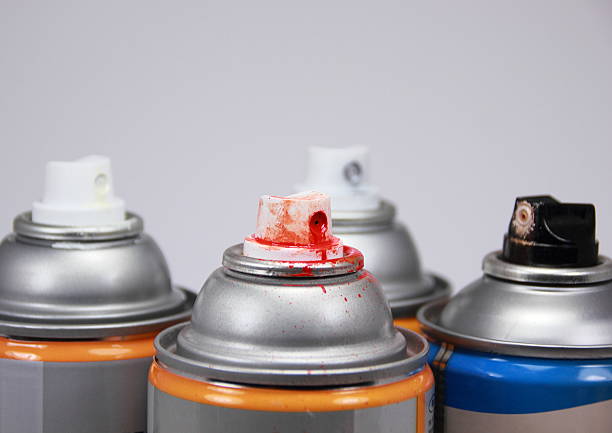 istock Top of four isolated spray cans with different colors 482437183