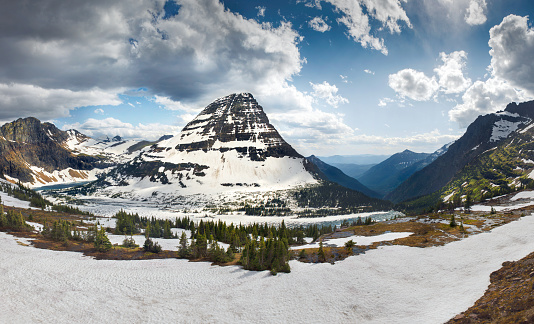 Hidden Lake and Bearhat mountain in Glacier National Park cover by snow.