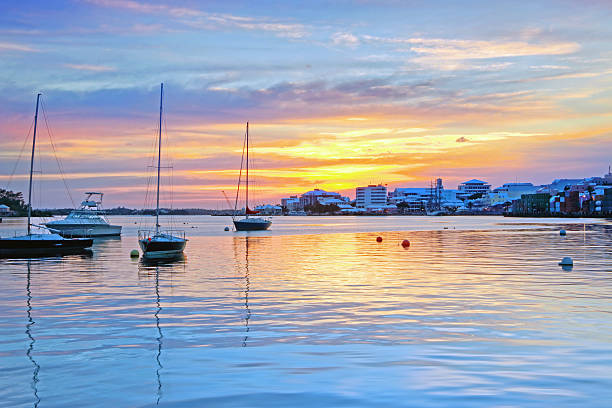 A sunset over Hamilton harbor with moored vessels. stock photo