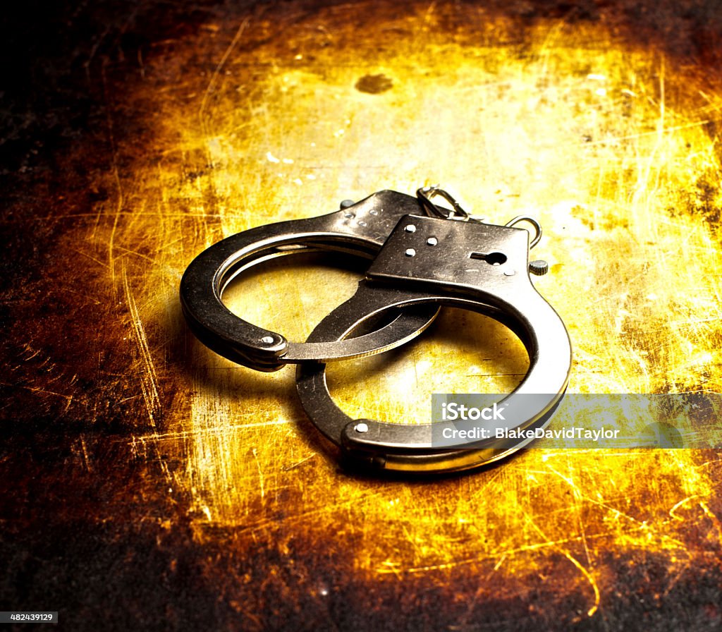 High Dynamic Range Photo Of Handcuffs Hight Dynamic Range (HDR) photo of police handcuffs Crime Stock Photo