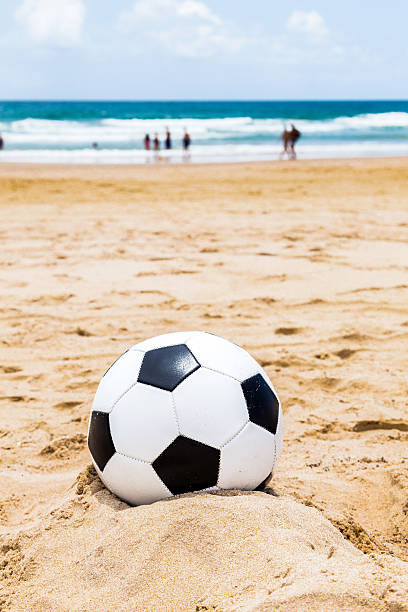 istock Soccer ball on the beach 482440378
