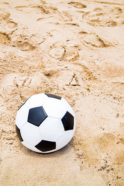 istock Soccer ball on the beach 482440874
