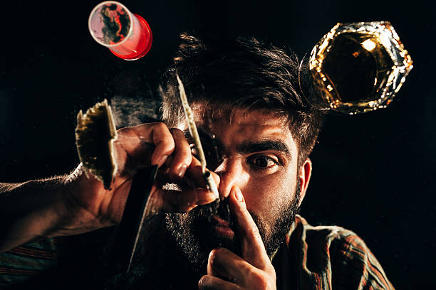 istock Man sniffing a line of cocaine 482446282