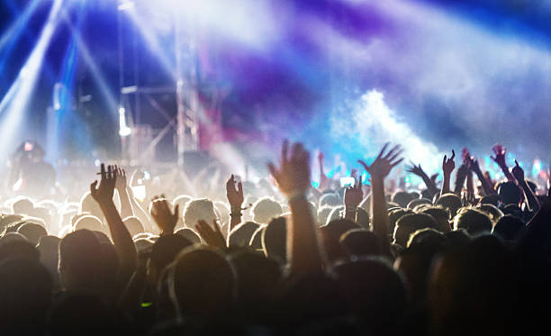 istock People at concert party. 482446732